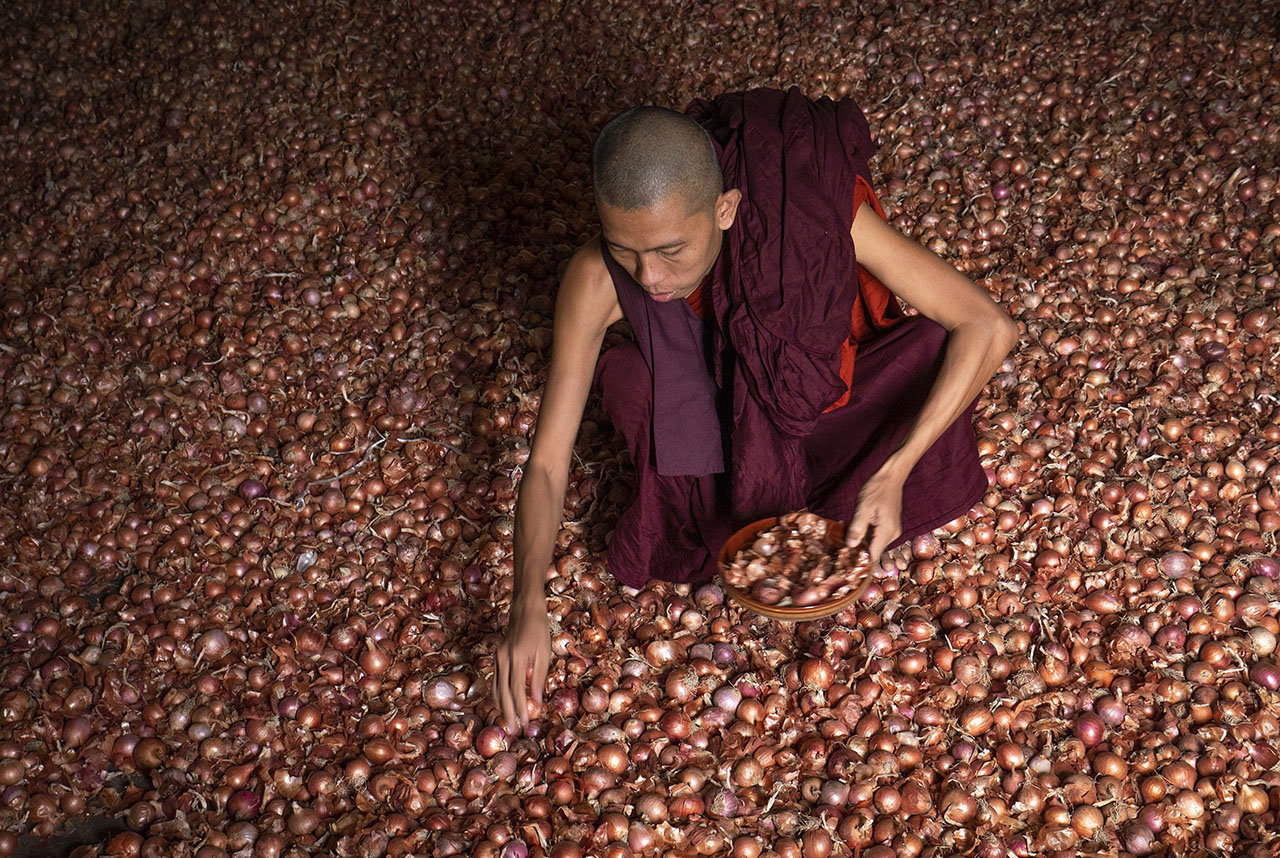 Sorting out the onions in a monastery storeroom, Mandalay, Myanmar ©2018